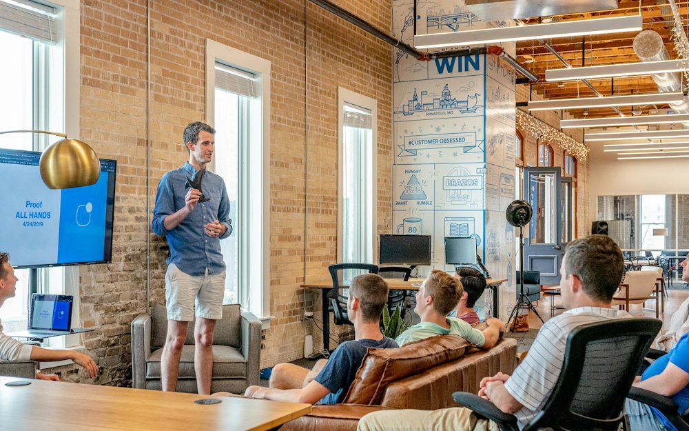 A speaker presenting to a team