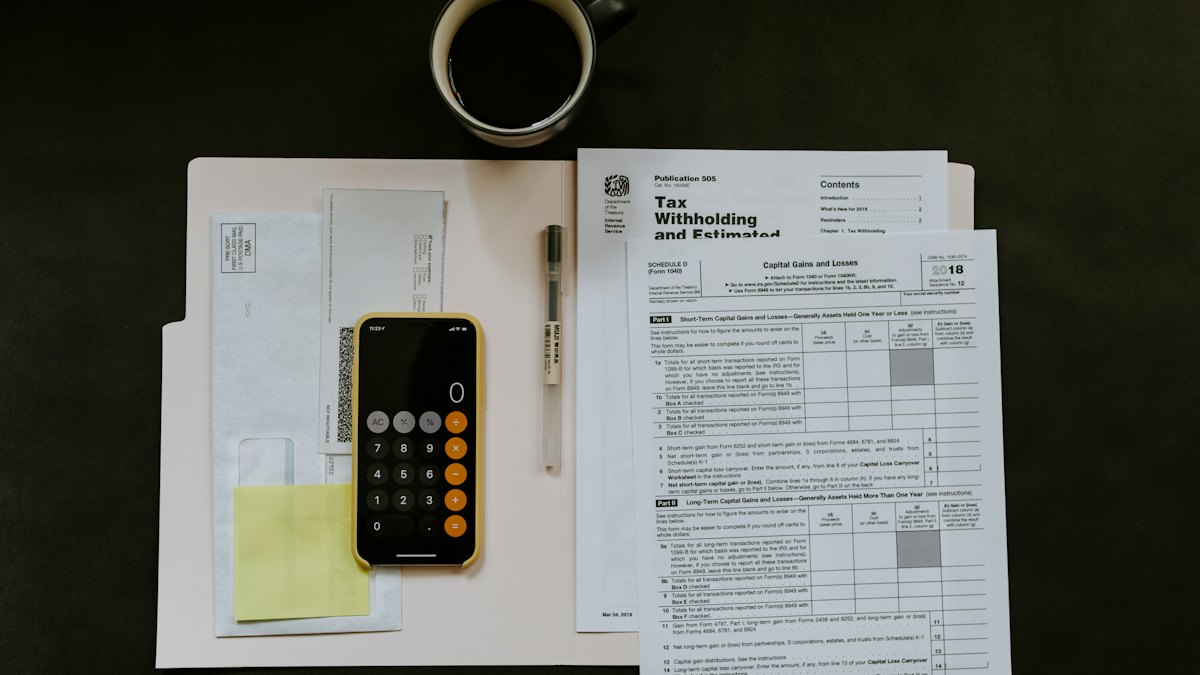 Papers and a calculator on a desk