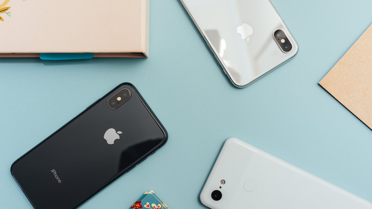 Phones and a notepad on a desk
