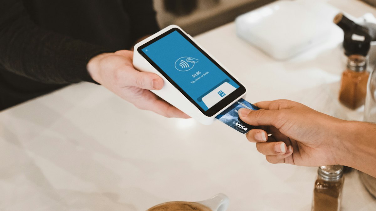Paying by card on a handheld payment device